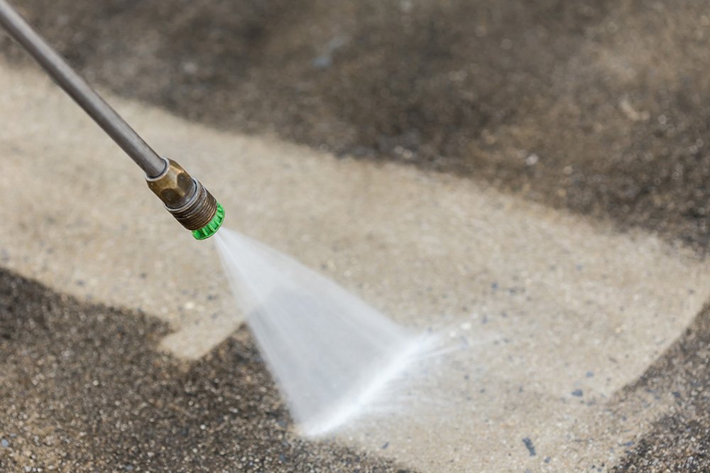 Pressure washer lance cleaning paving