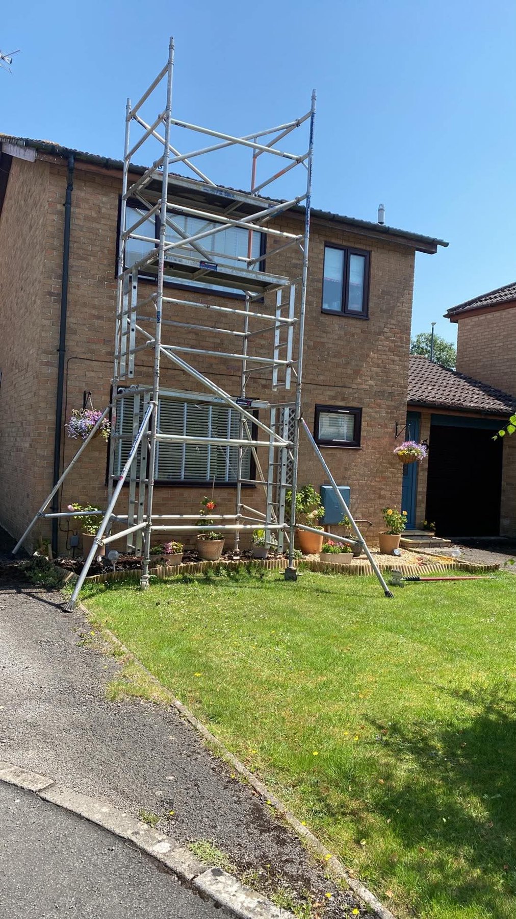Roof cleaning access setup with scaffolding